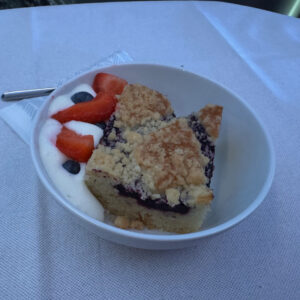 Blueberry pie with berries and vanilla sauce