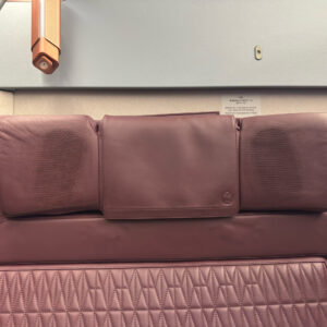 Headrest-mounted speakers