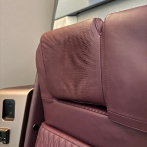 Headrest-mounted speakers